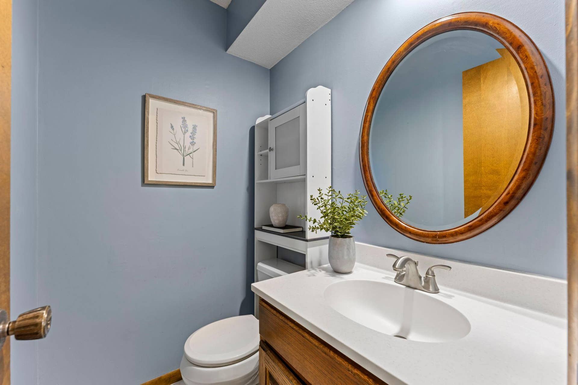7181 Steepleview Road, Woodbury, MN 55125 The guest bathroom on the main level is clean and ready to host.