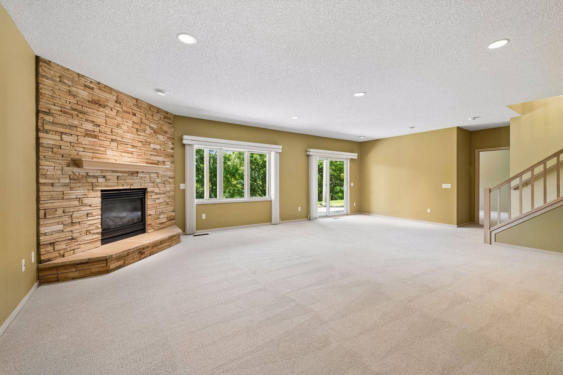7063 Oak Pointe Curve, Bloomington, MN 55438 Lower Level Family Room is well lit and walks out to backyard and patio