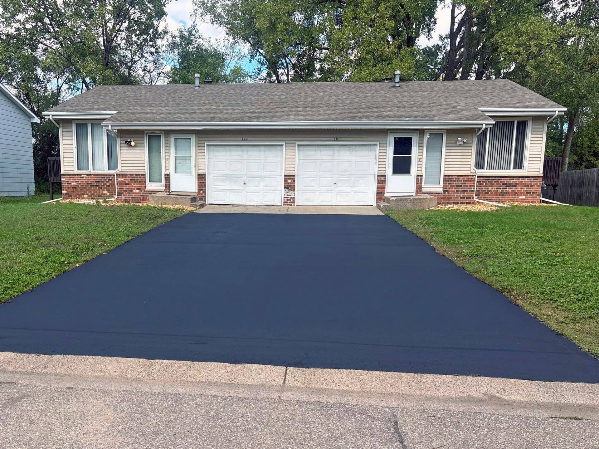 Welcome home! Driveway freshly seal coated.
