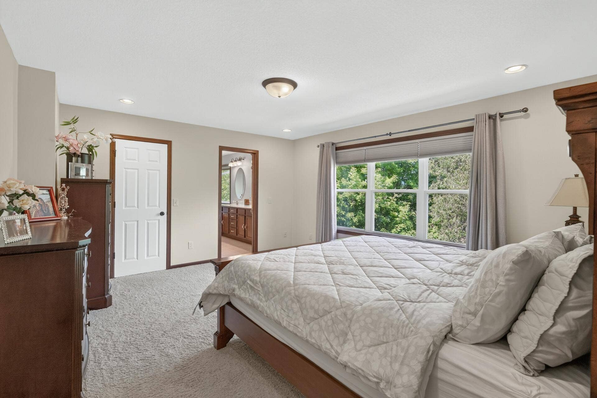 10548 Noble Circle N, Brooklyn Park, MN 55443 Primary Bedroom: Large primary bedroom with plenty of space for a king-size bed and additional furnishings.