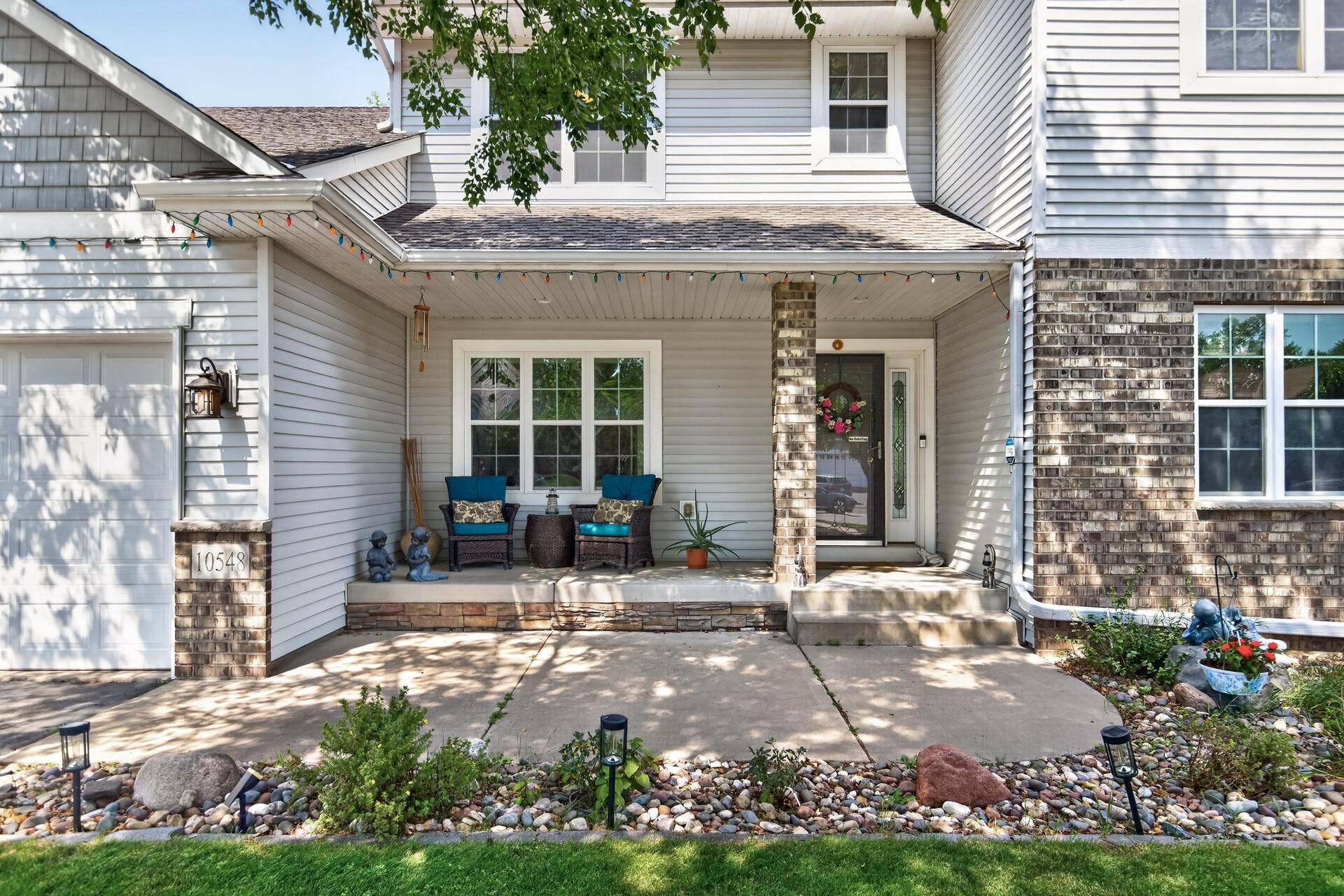 10548 Noble Circle N, Brooklyn Park, MN 55443 Front Exterior: Beautiful curb appeal with a welcoming front entry and well-maintained landscaping.