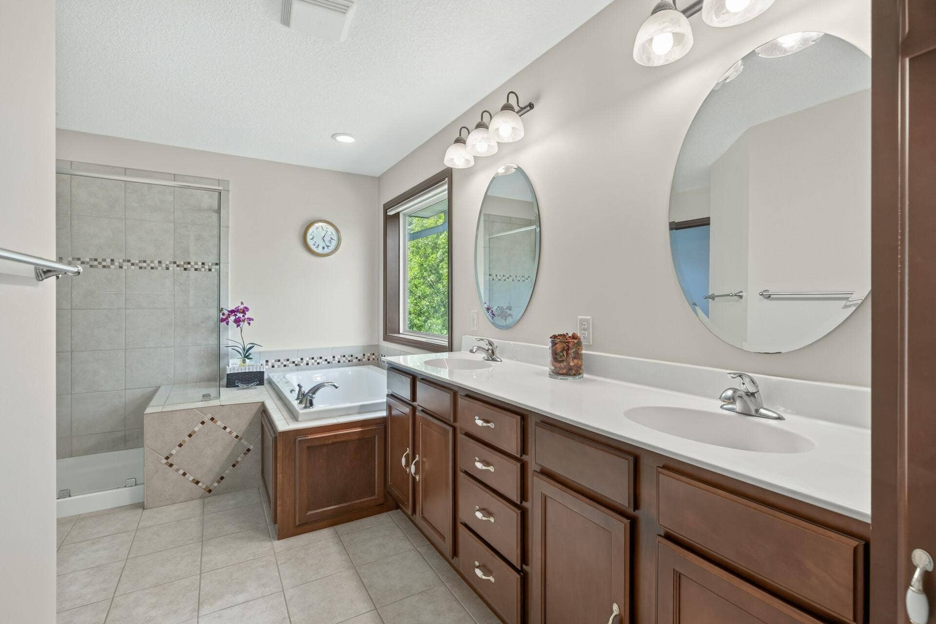 10548 Noble Circle N, Brooklyn Park, MN 55443 Primary Bath: Private primary bath featuring a relaxing jetted tub and separate walk-in shower.