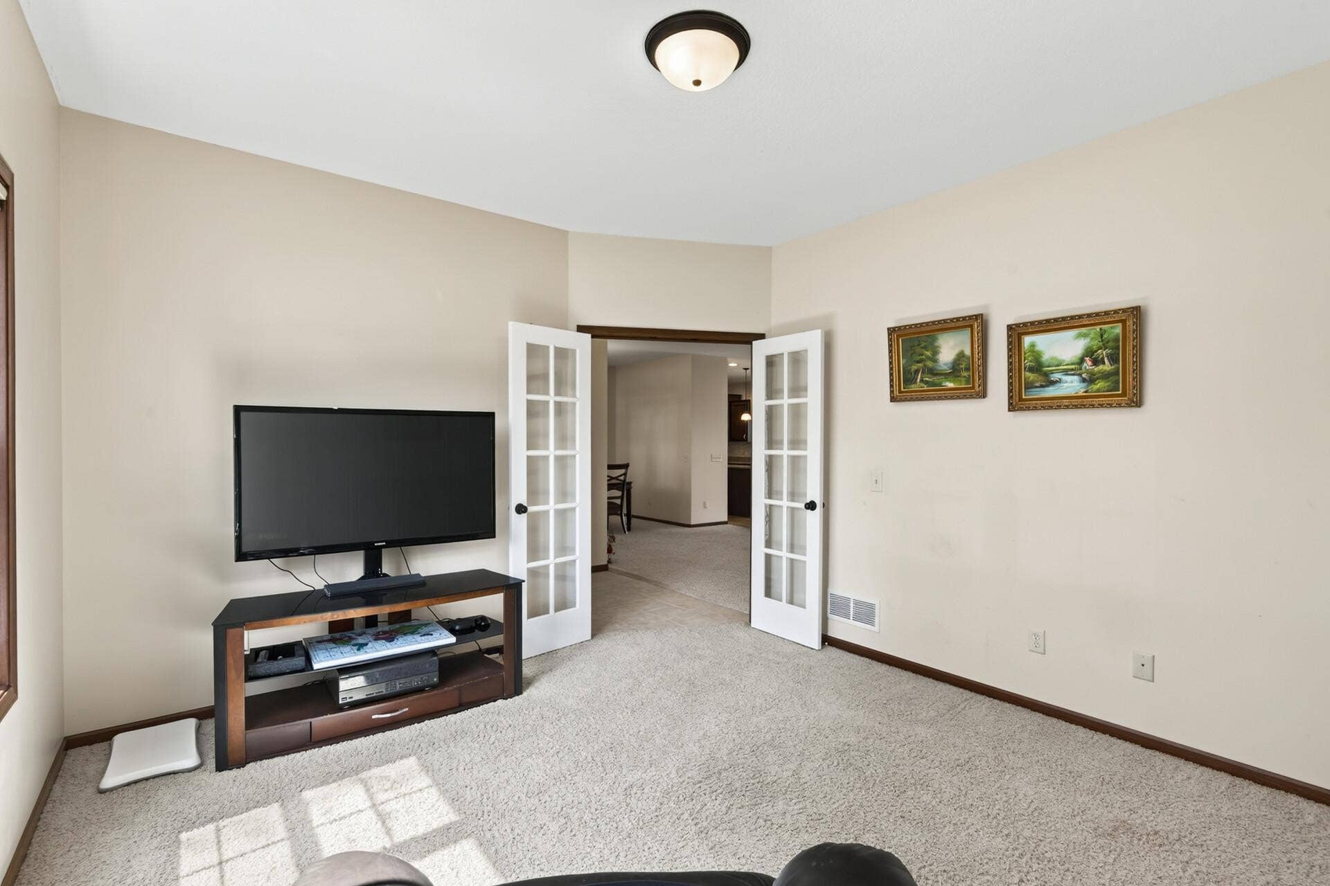 10548 Noble Circle N, Brooklyn Park, MN 55443 Den: Private den with French doors, perfect for a home office or flex space.