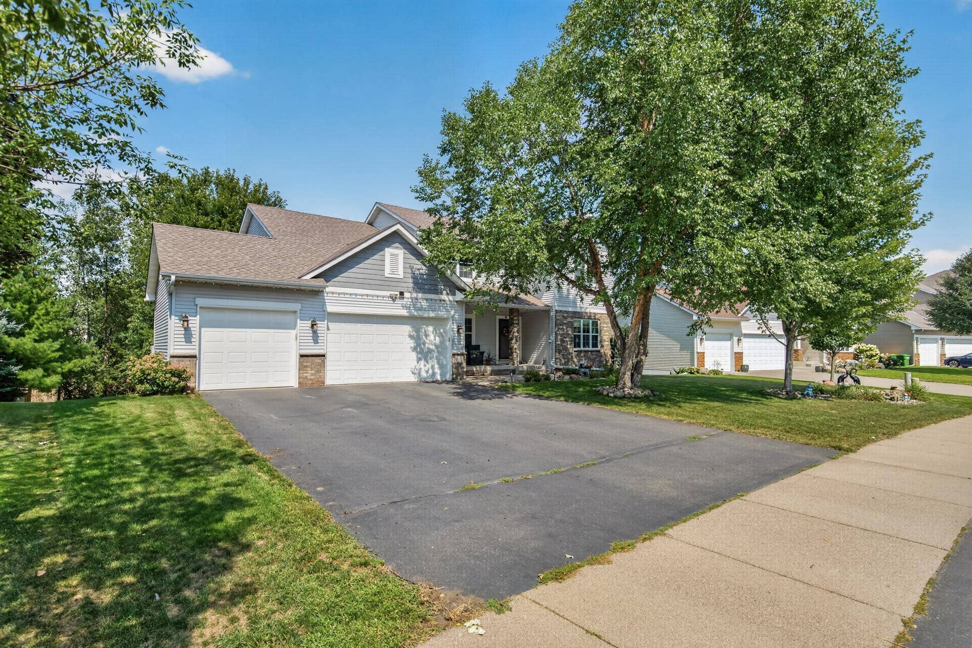 10548 Noble Circle N, Brooklyn Park, MN 55443 Front Exterior: Beautiful curb appeal with a welcoming front entry and well-maintained landscaping.