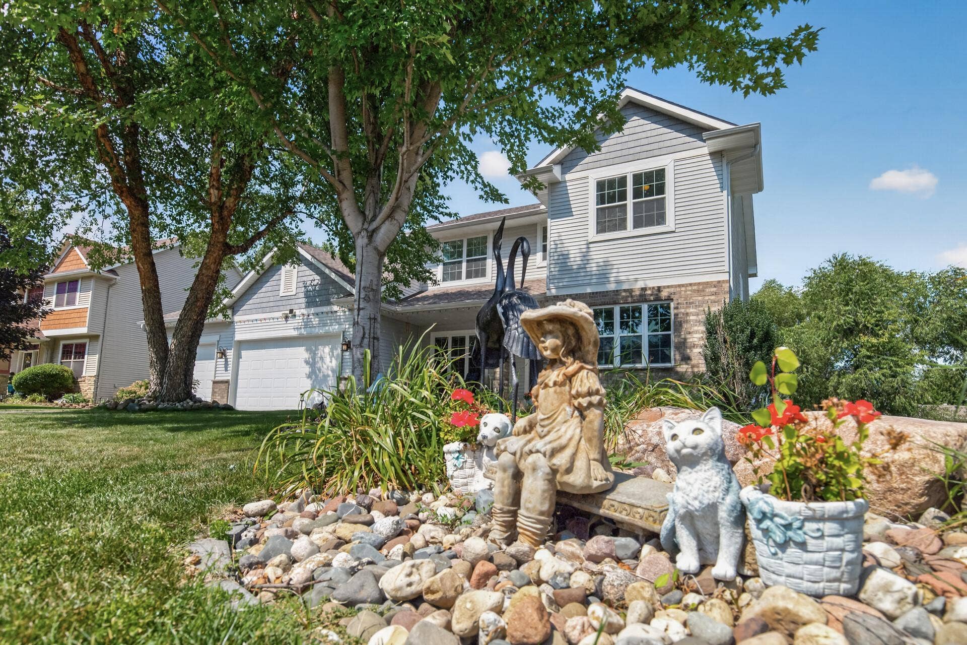 10548 Noble Circle N, Brooklyn Park, MN 55443 Front Exterior: Beautiful curb appeal with a welcoming front entry and well-maintained landscaping.