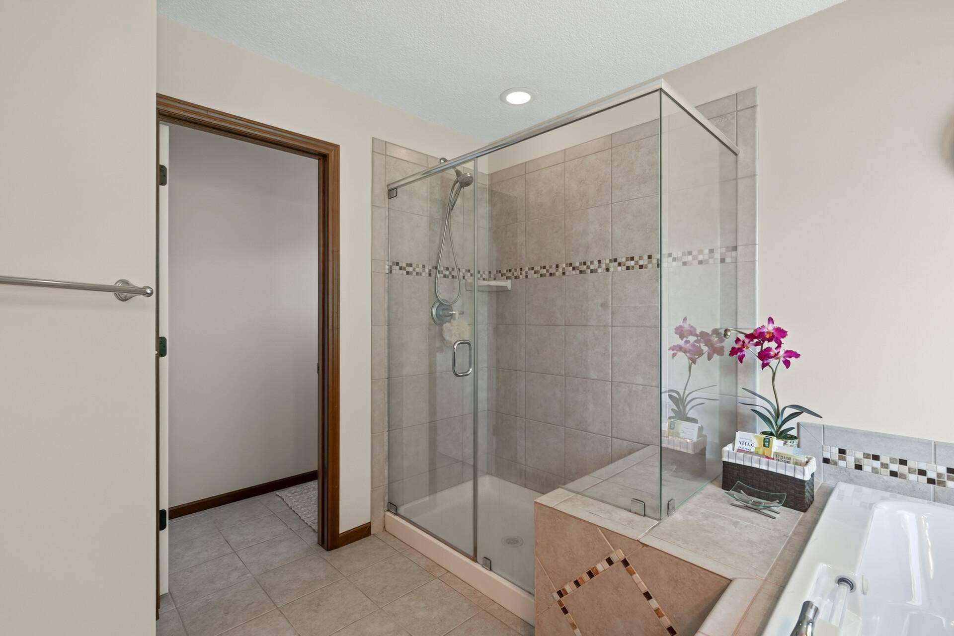10548 Noble Circle N, Brooklyn Park, MN 55443 Primary Bath: Private primary bath featuring a relaxing jetted tub and separate walk-in shower.