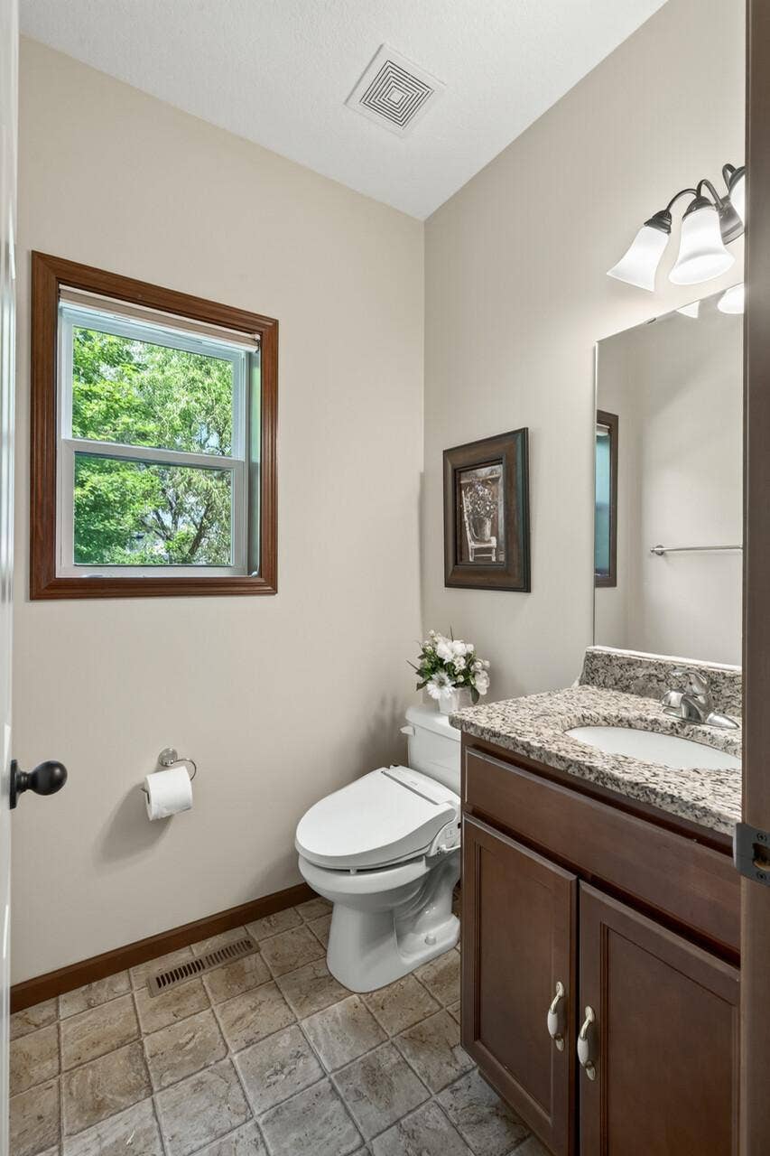 10548 Noble Circle N, Brooklyn Park, MN 55443 Main Floor Half Bath: Convenient main-level half bath perfect for guests.