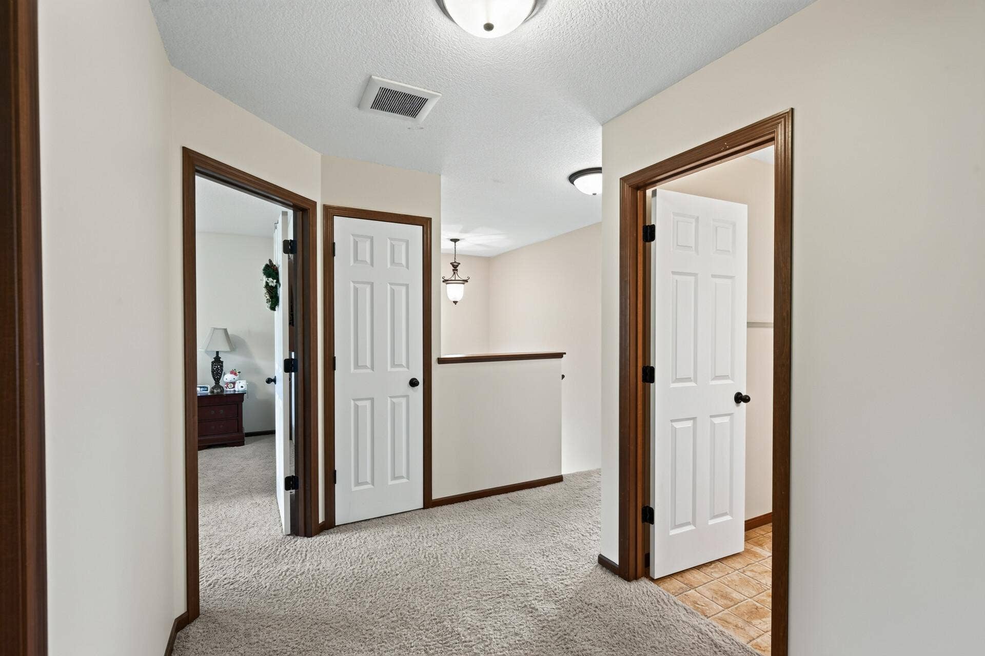 10548 Noble Circle N, Brooklyn Park, MN 55443 Upper Level: Spacious upper level featuring four bedrooms, a full bathroom, and a large laundry room for added convenience.