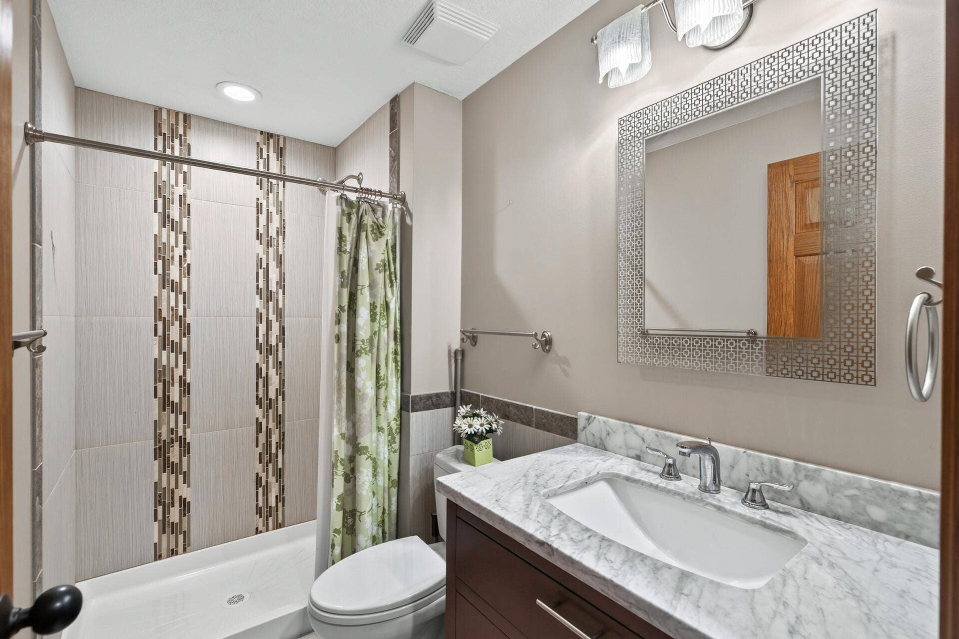 10548 Noble Circle N, Brooklyn Park, MN 55443 Basement Bath: Beautifully remodeled bathroom with updated finishes.
