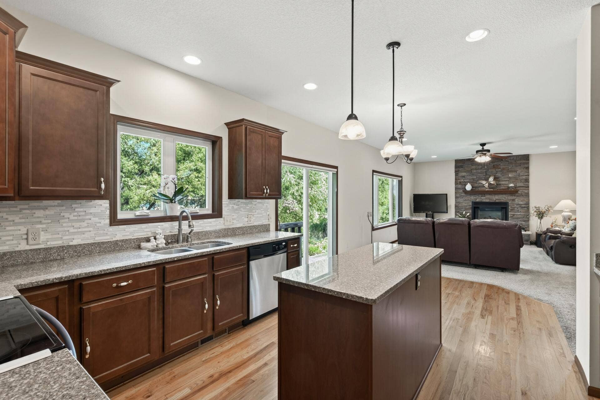 10548 Noble Circle N, Brooklyn Park, MN 55443 Kitchen: Beautiful kitchen featuring a spacious center island with granite countertops and ample cabinetry for storage.