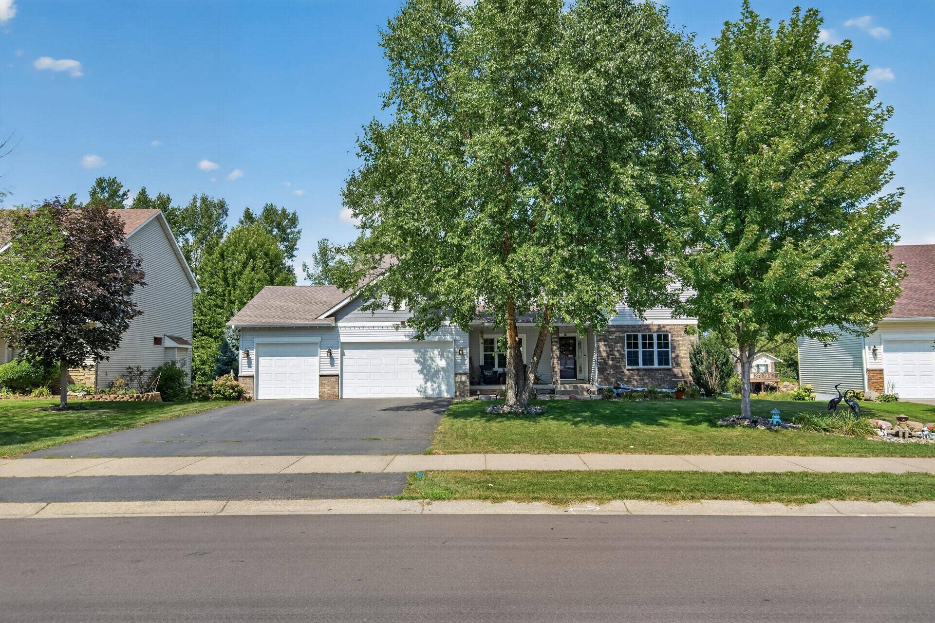 10548 Noble Circle N, Brooklyn Park, MN 55443 Front Exterior: Beautiful curb appeal with a welcoming front entry and well-maintained landscaping.
