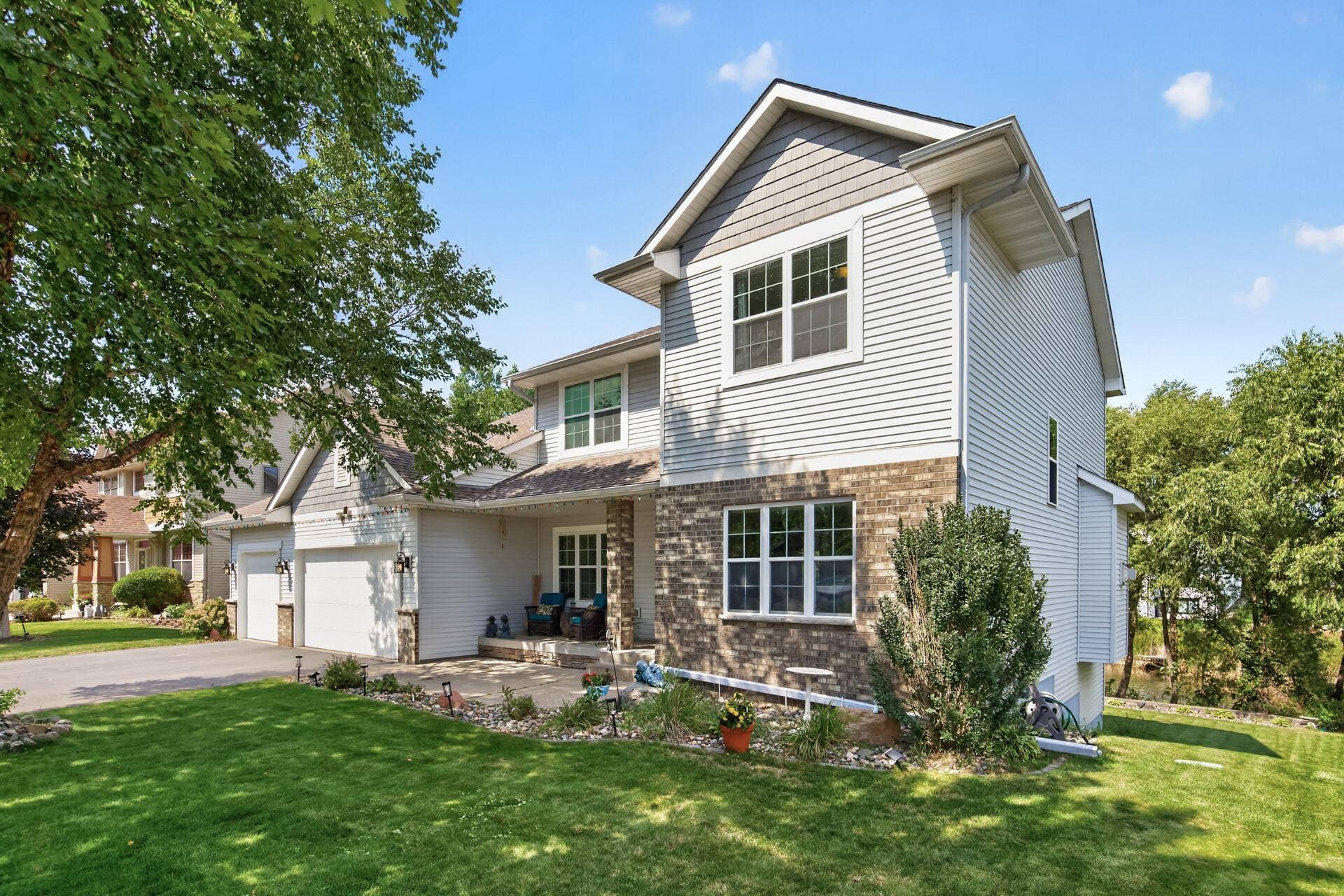 10548 Noble Circle N, Brooklyn Park, MN 55443 Front Exterior: Beautiful curb appeal with a welcoming front entry and well-maintained landscaping.