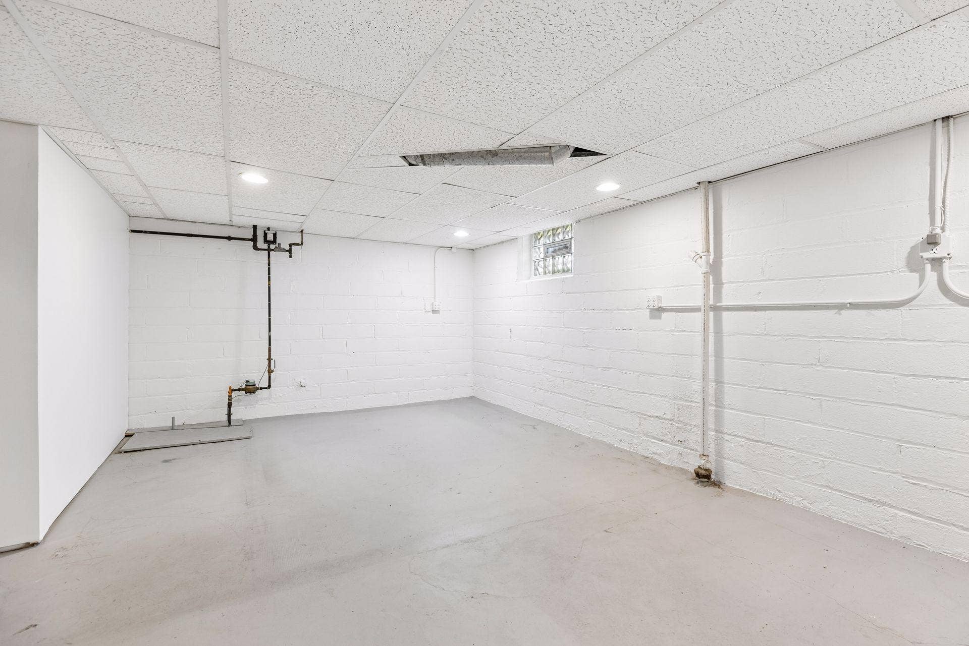 Alternate view of the unfinished basement space.