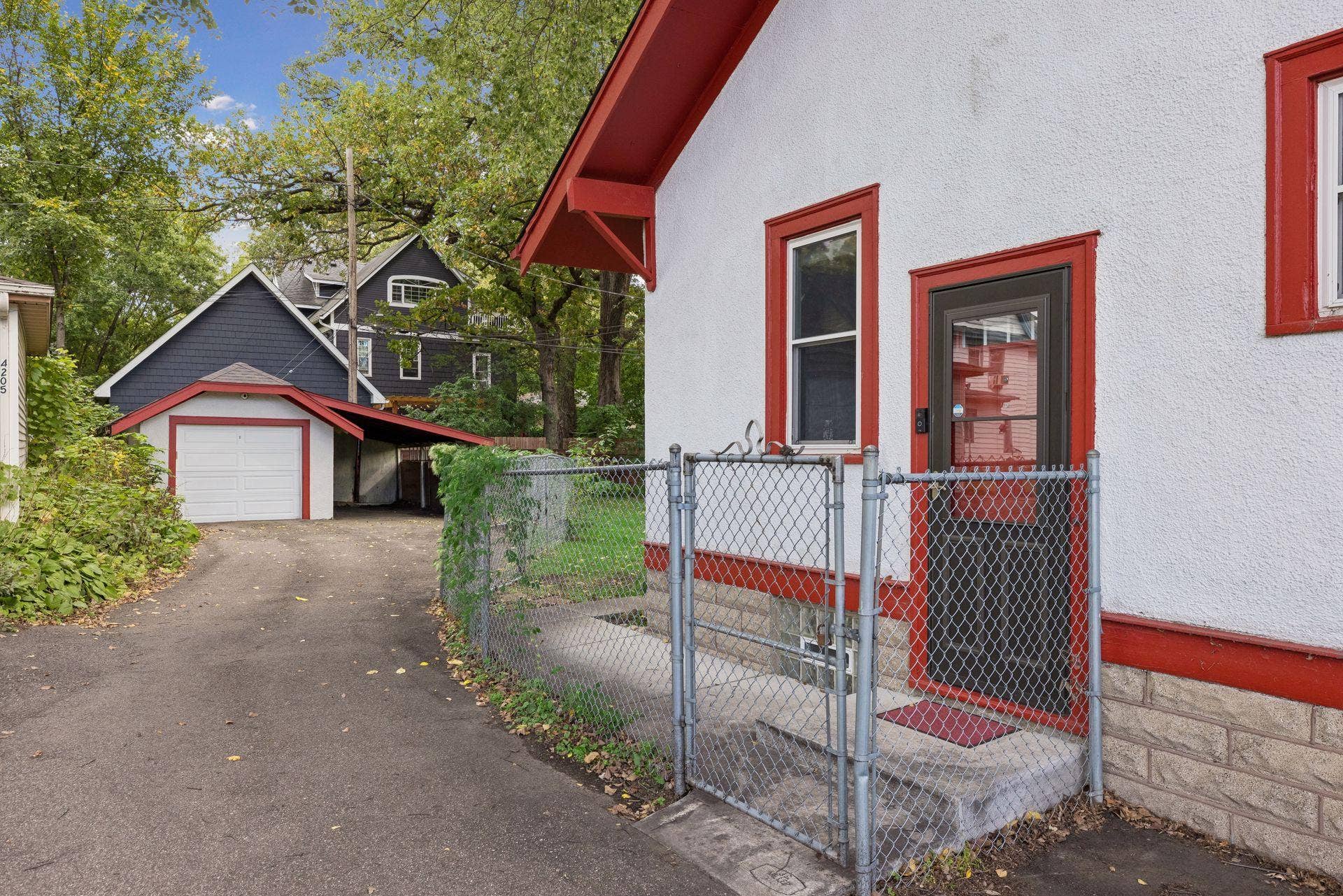 Side door leads to a walkway and the driveway.