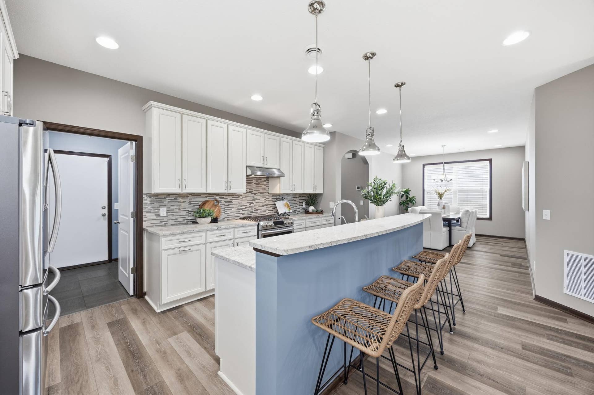7417 Shadyview Lane N, Maple Grove, MN 55311 Spacious kitchen with oversized island, pendant lighting, and seamless flow to the large formal dining area.