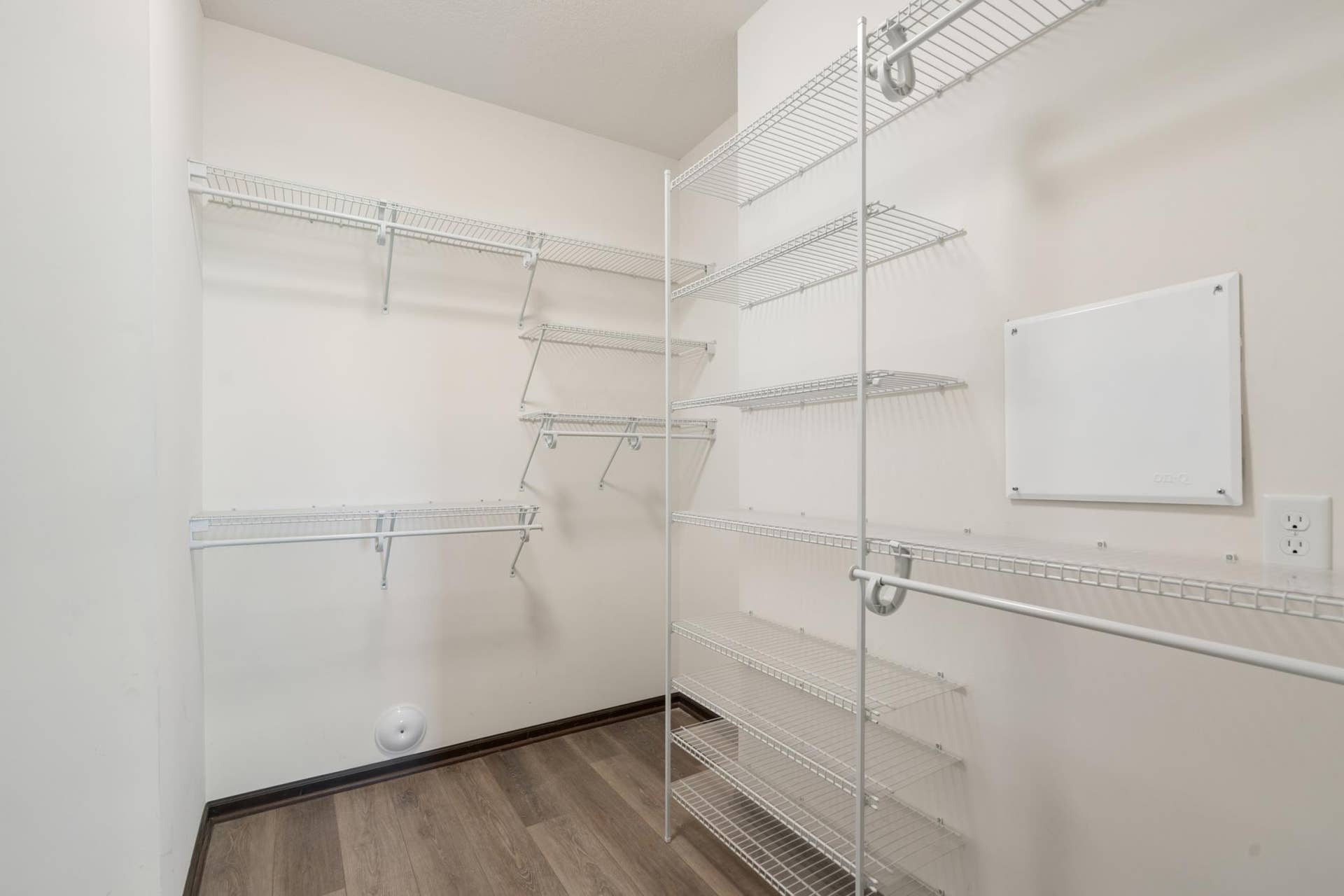 7417 Shadyview Lane N, Maple Grove, MN 55311 Large primary bedroom walk-in closet with extensive shelving and organized storage system.