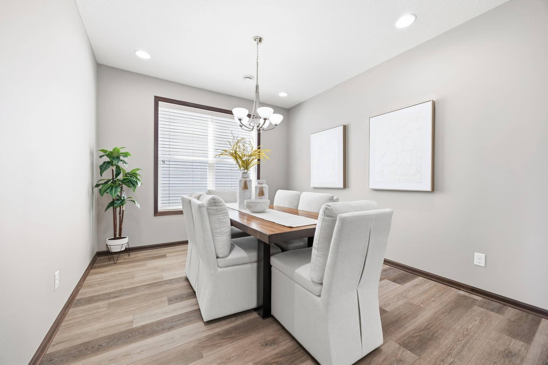 7417 Shadyview Lane N, Maple Grove, MN 55311 Dedicated dining area with elegant lighting and open archway.