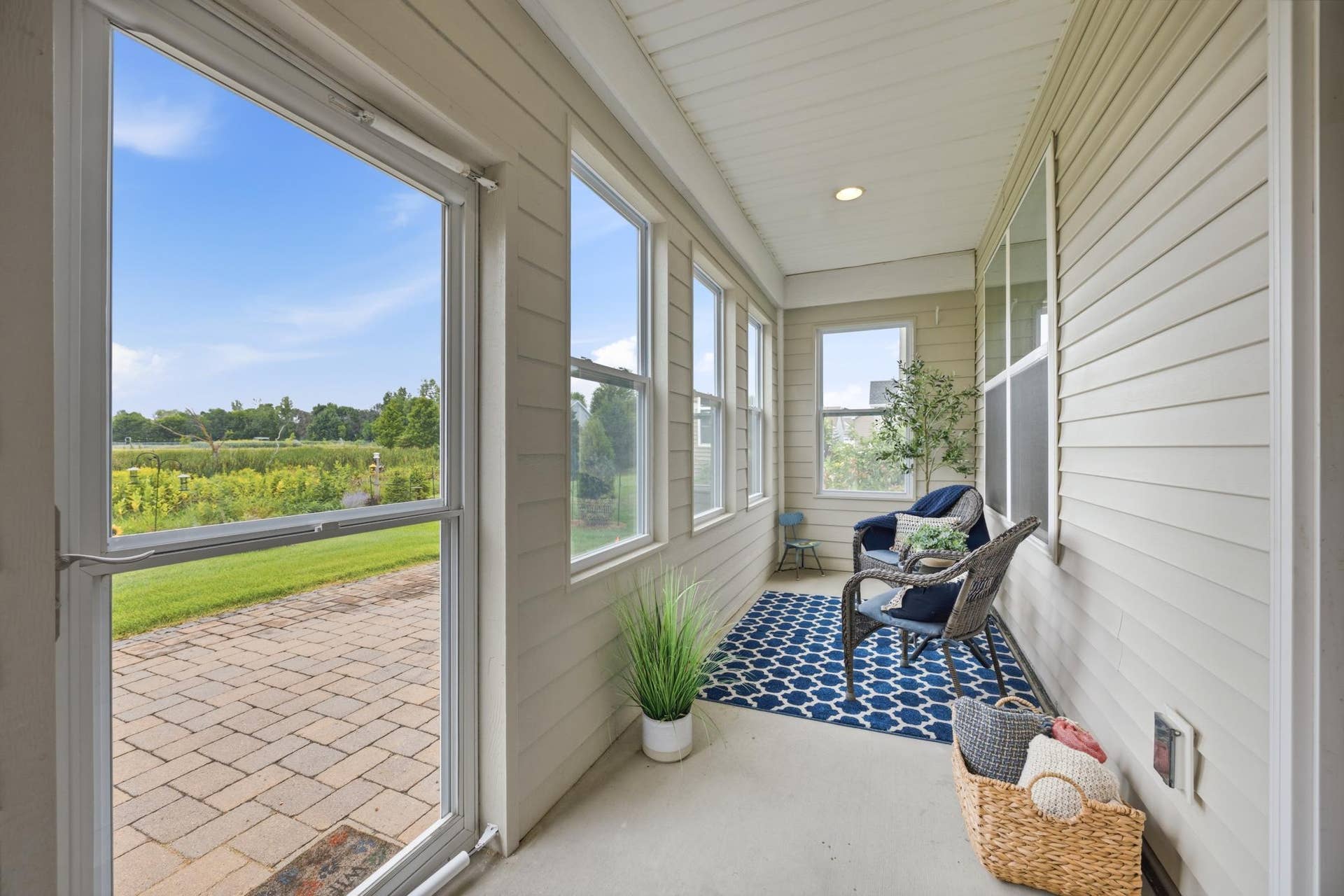 7417 Shadyview Lane N, Maple Grove, MN 55311 Cozy and bright 3-season porch with brand new windows overlooking the scenic backyard.