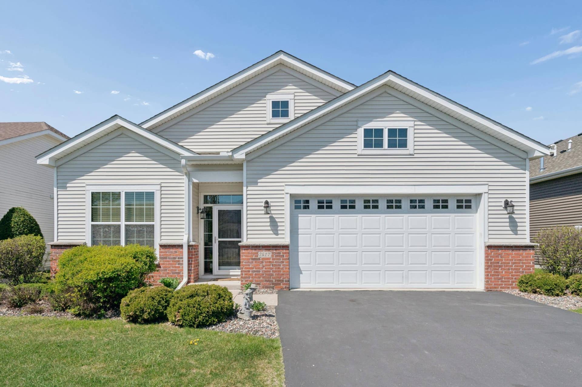 7417 Shadyview Lane N, Maple Grove, MN 55311 Inviting front exterior with charming curb appeal, attached garage, and welcoming covered entry.