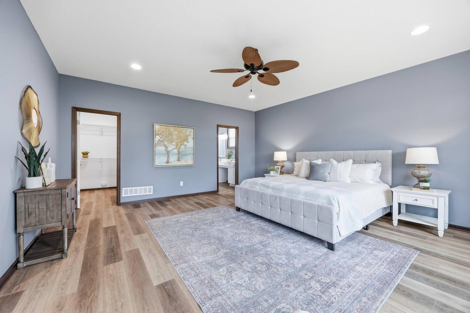 7417 Shadyview Lane N, Maple Grove, MN 55311 Primary bedroom is generously size with room for plenty of furniture, private access to the 3 season porch, and a large walk-in closet.
