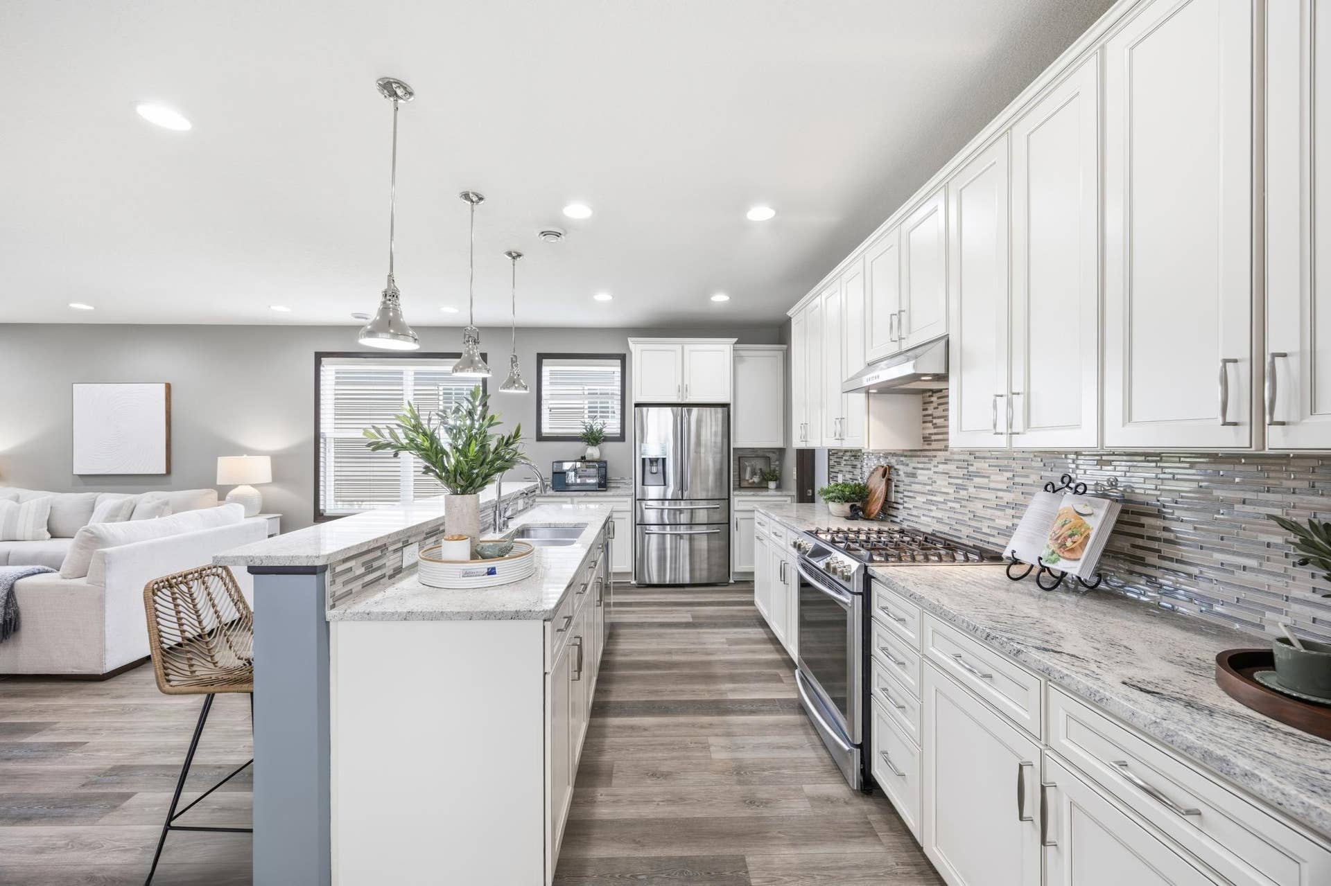 7417 Shadyview Lane N, Maple Grove, MN 55311 Gourmet kitchen featuring large center island, stainless steel appliances, and open-concept design.