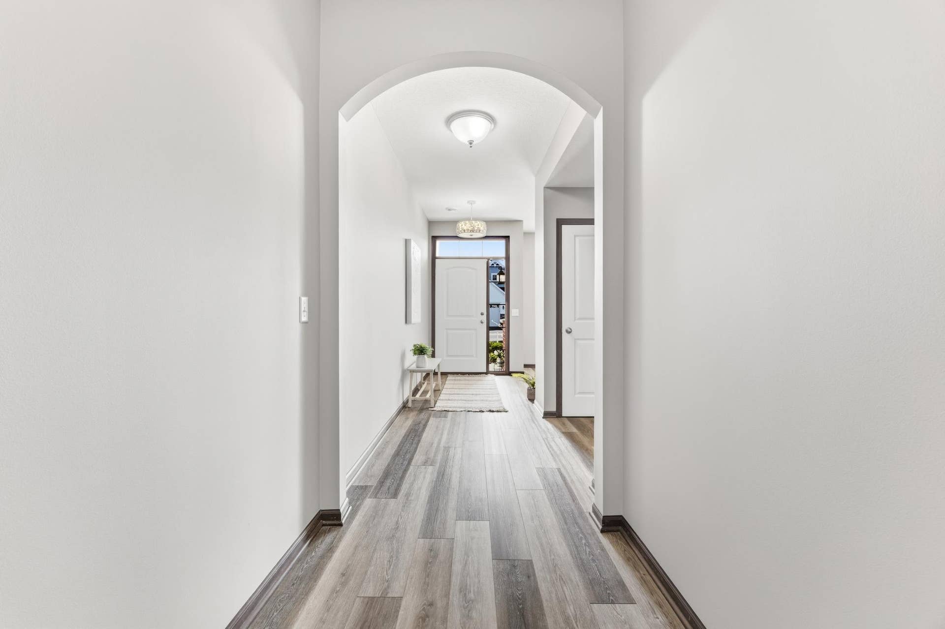 7417 Shadyview Lane N, Maple Grove, MN 55311 Welcoming entryway with arched architectural detail and durable flooring that flows throughout the main level.