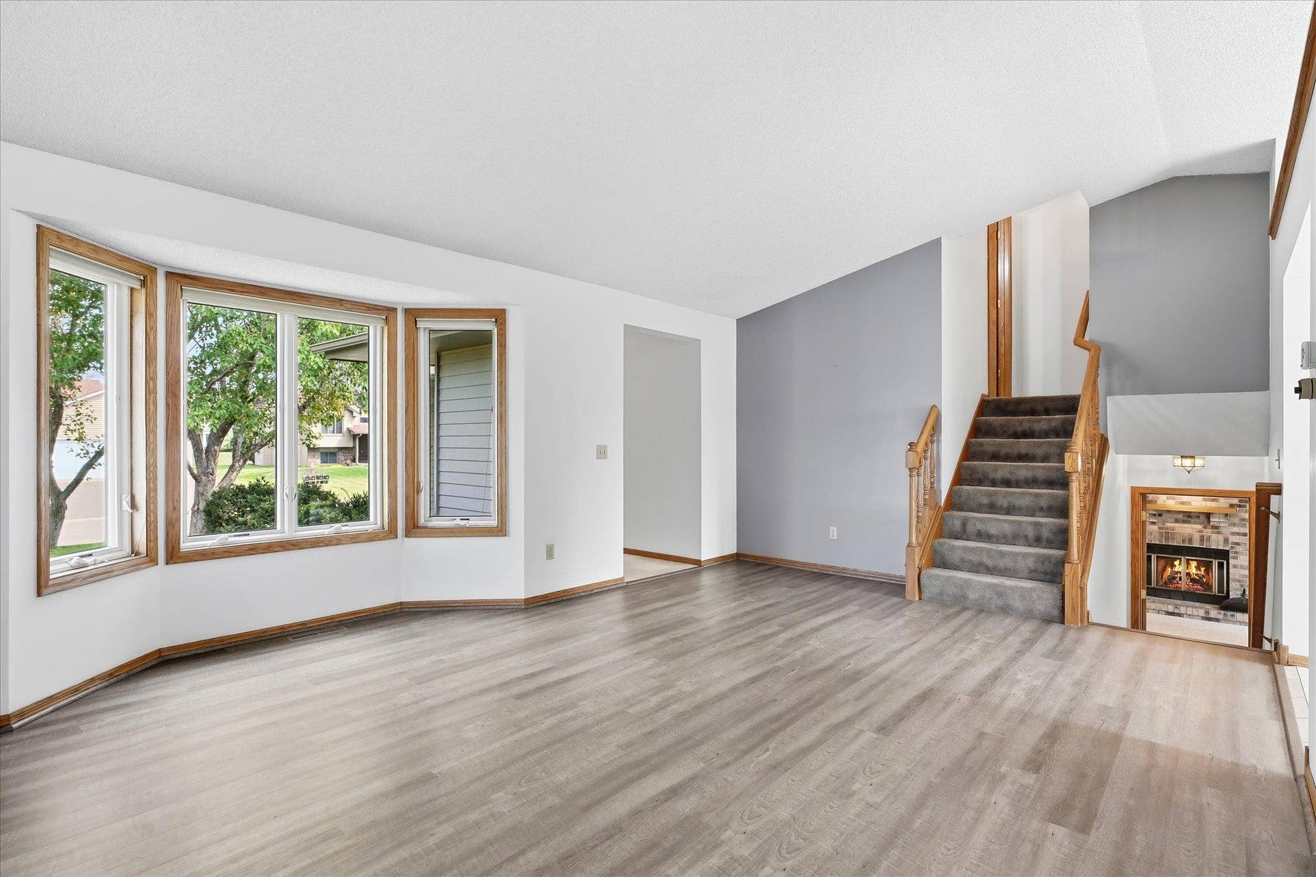 9225 Queens Gardens, Brooklyn Park, MN 55443 The upper level hallway has new carpet.