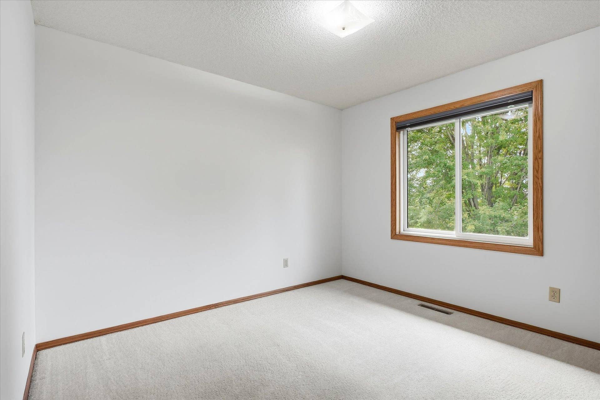 9225 Queens Gardens, Brooklyn Park, MN 55443 Third upper-level bedroom offers a versatile space ideal for a bedroom, home office, or hobby room.