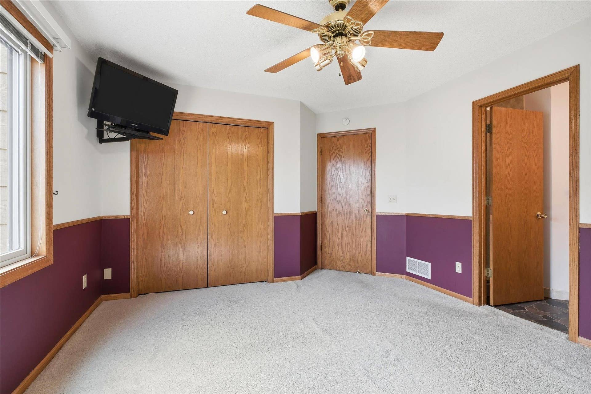 9225 Queens Gardens, Brooklyn Park, MN 55443 The primary bedroom includes the added convenience of its own private bath.