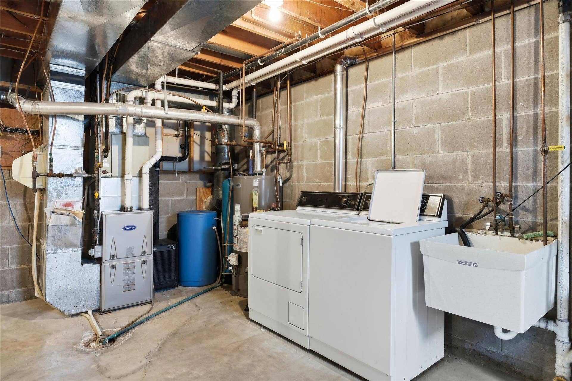 9225 Queens Gardens, Brooklyn Park, MN 55443 Major mechanical update includes a new furnace in 2024 with AprilAire, owned water softener and water heater replaced in 2022, providing added peace of mind for the next owner.