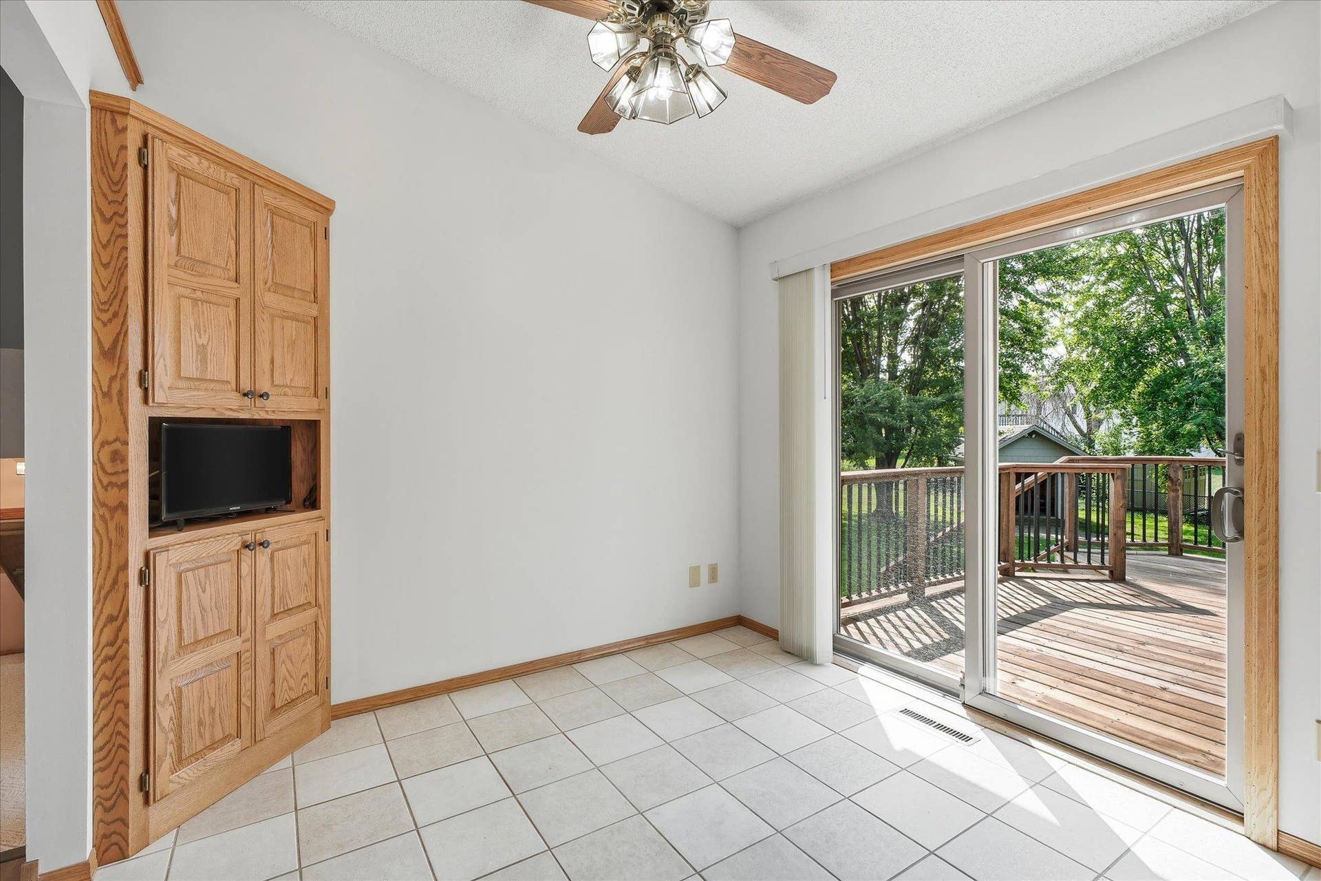 9225 Queens Gardens, Brooklyn Park, MN 55443 Custom built-in cabinet and shelving for convenient dinning room storage.