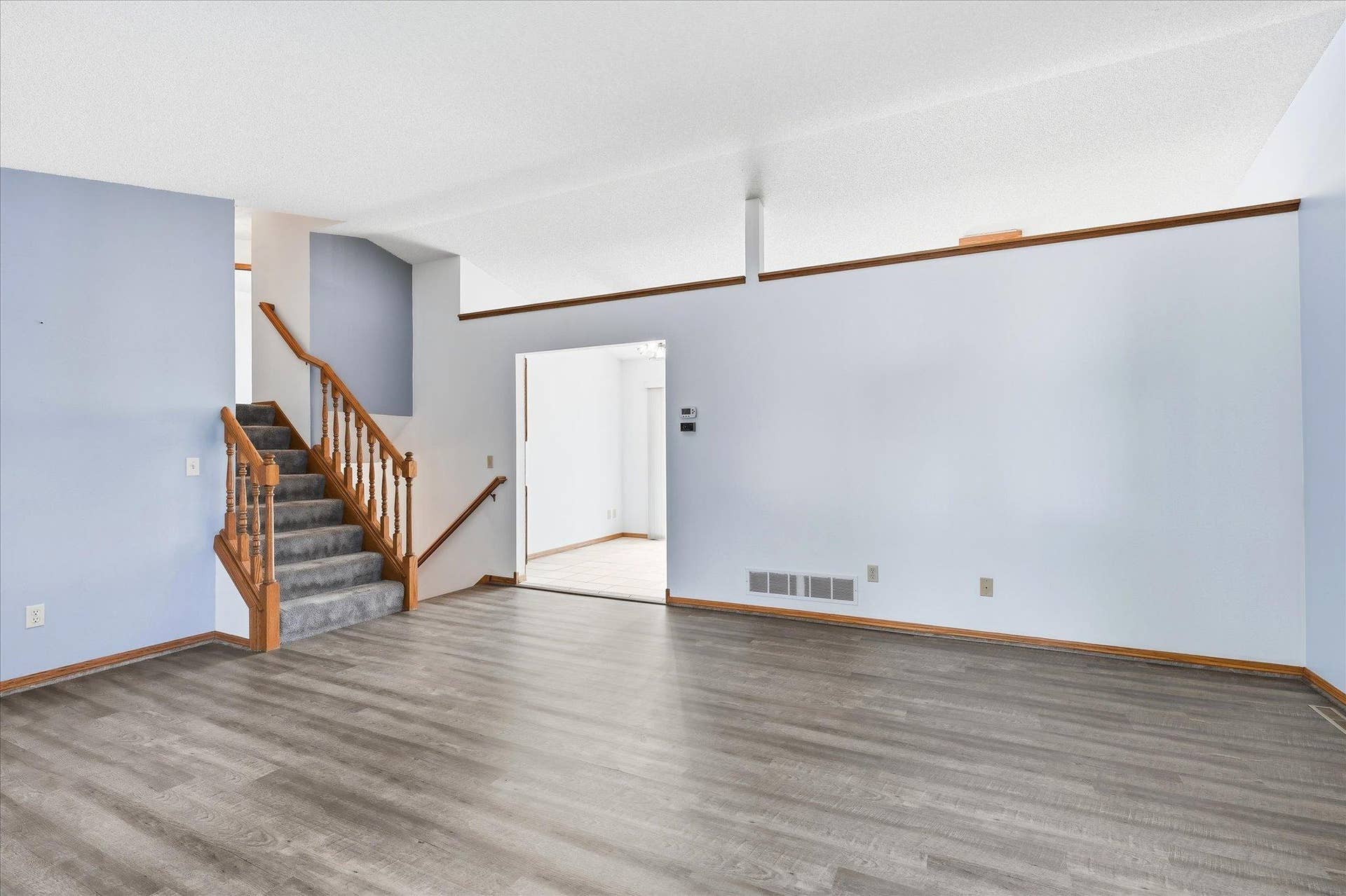 9225 Queens Gardens, Brooklyn Park, MN 55443 An open layout creates an easy transition from the living room into the kitchen and dining areas.