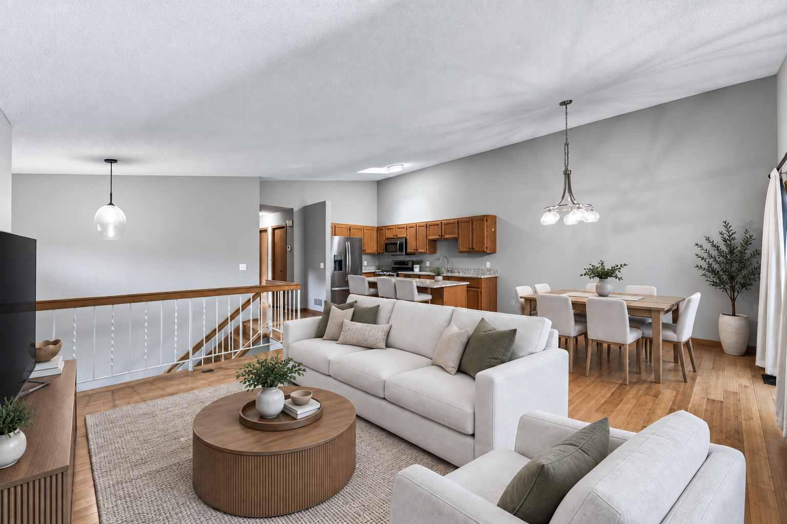 6865 Romeo Road, Woodbury, MN 55125 Image has been virtually staged. The open-concept design allows connection without sacrificing defined spaces.