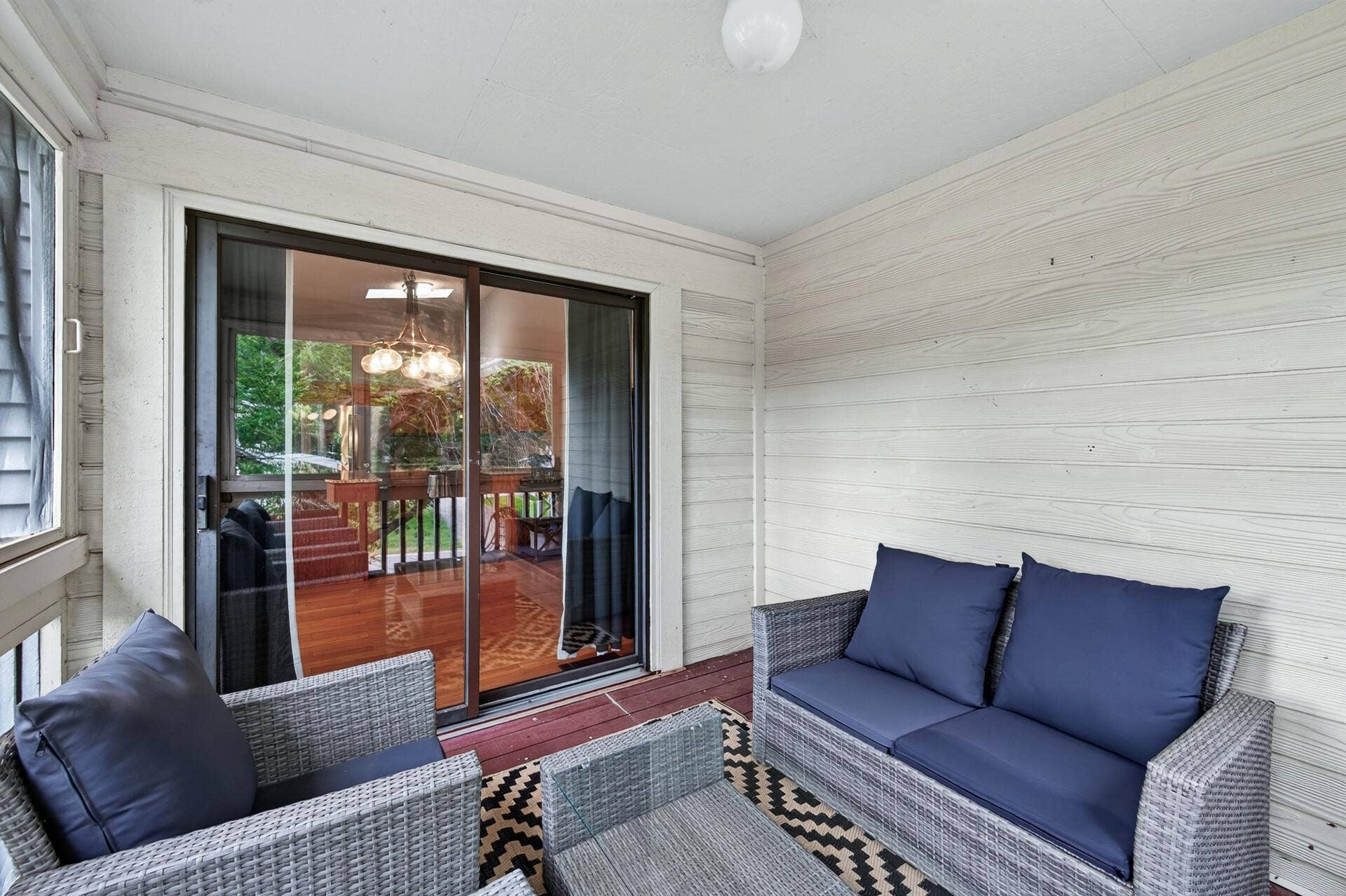 6865 Romeo Road, Woodbury, MN 55125 Conveniently located just off the dining area, this three-season porch seamlessly extends your living and entertaining space.