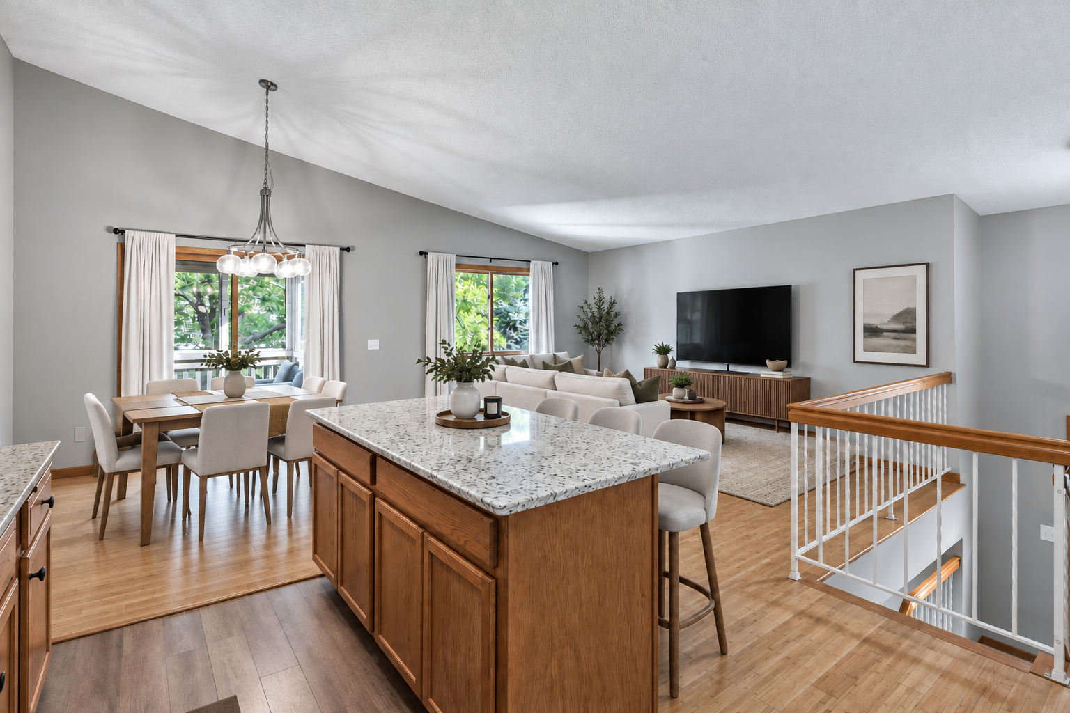 6865 Romeo Road, Woodbury, MN 55125 Image has been virtually staged. A large center island anchors the kitchen while the open layout creates an easy connection to the dining and living room.