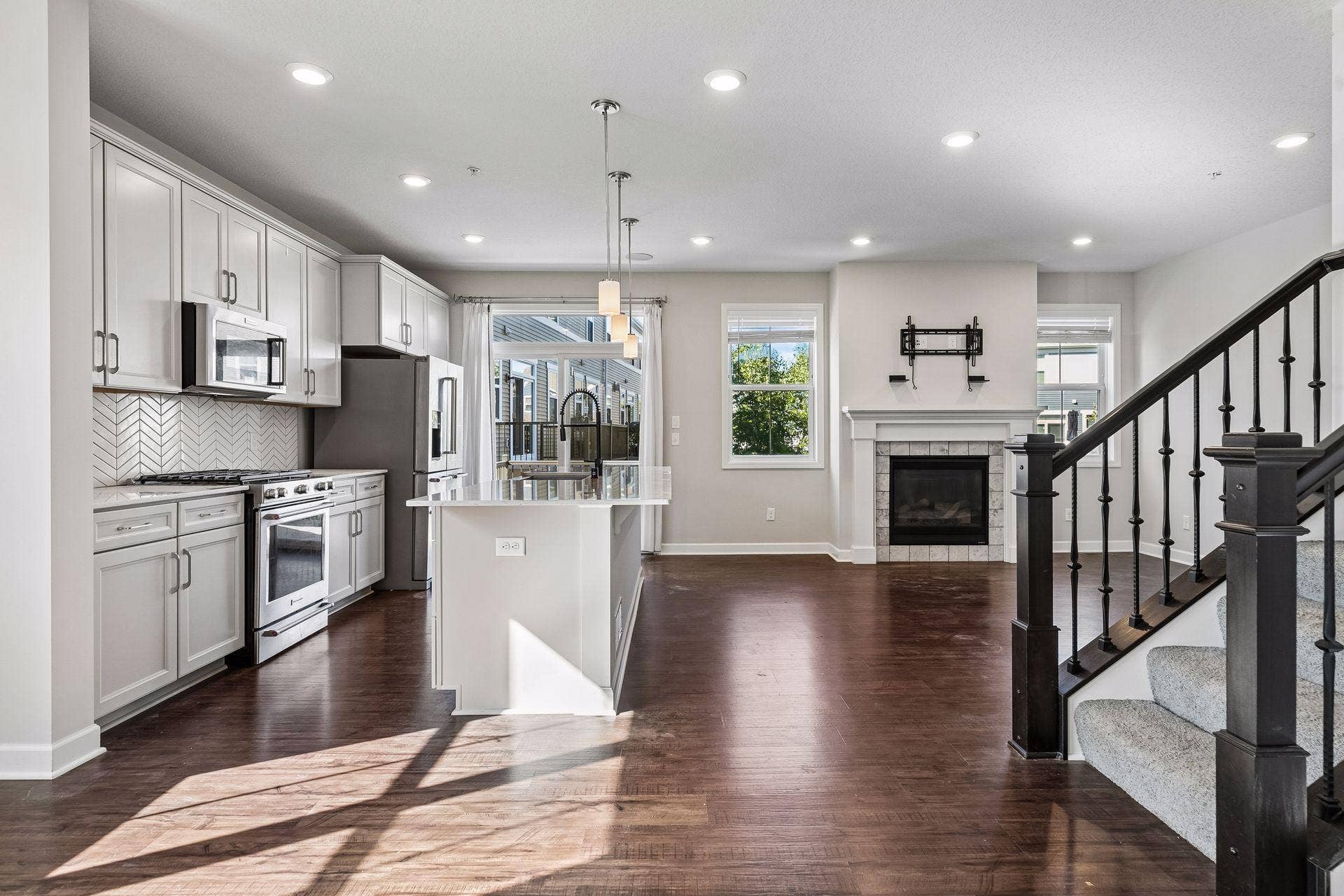 4297 Corn Silk Lane, Woodbury, MN 55129 Kitchen and living room. Open floor plan.