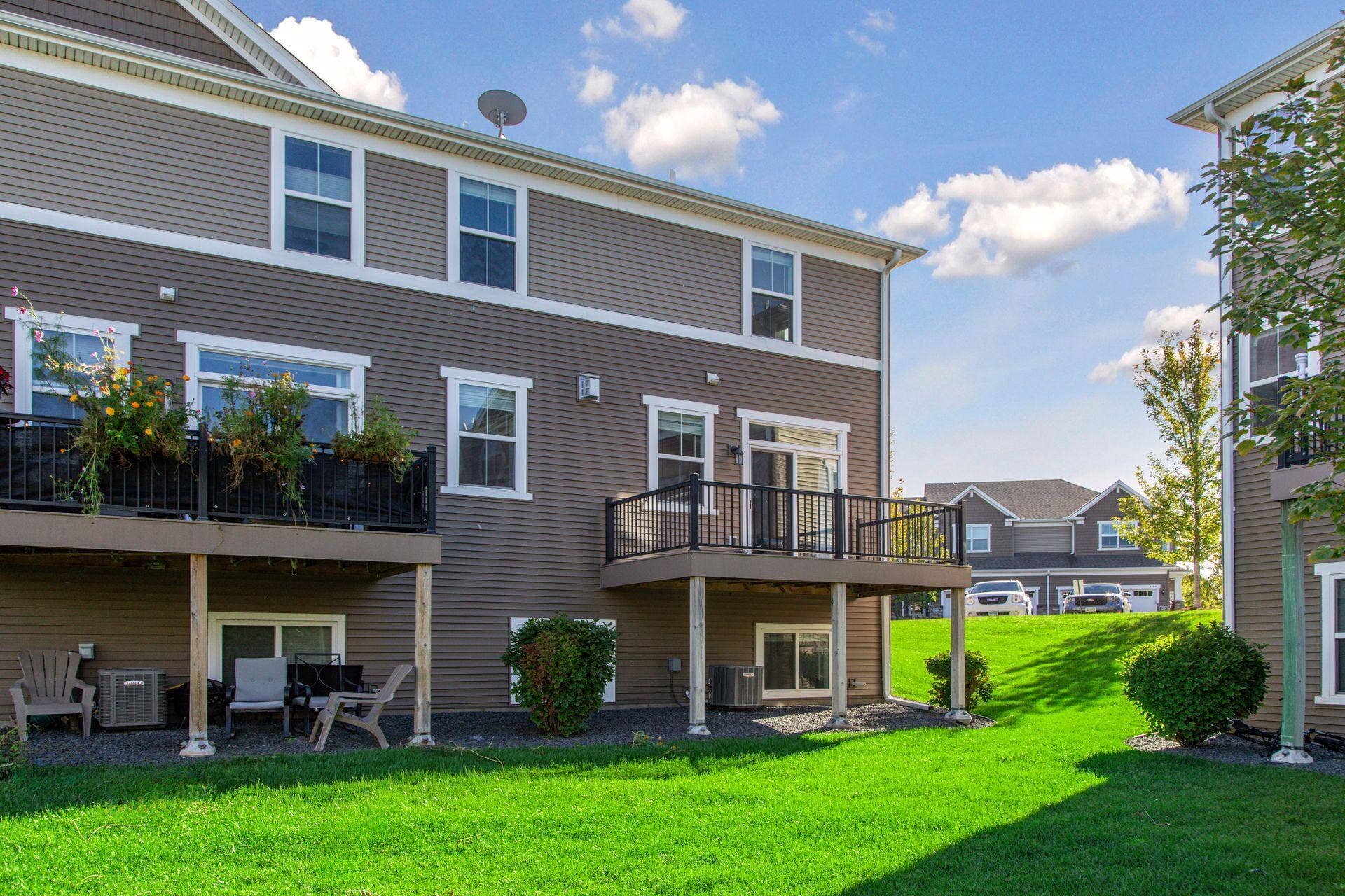 4297 Corn Silk Lane, Woodbury, MN 55129 Back of end unit townhome with deck