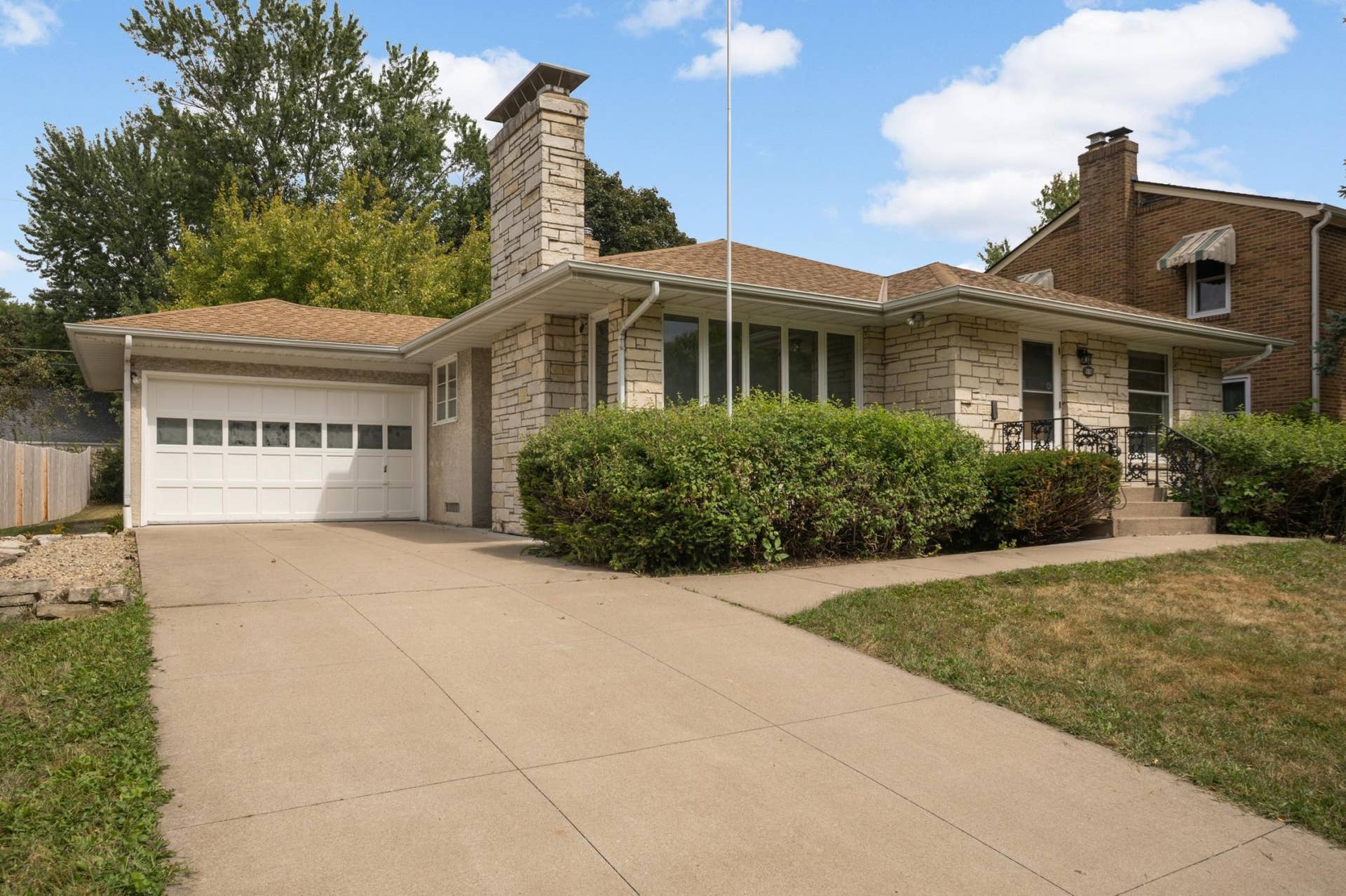 1009 Orange Avenue E, 98, Saint Paul, MN 55106 Stone exterior with oversized one car garage