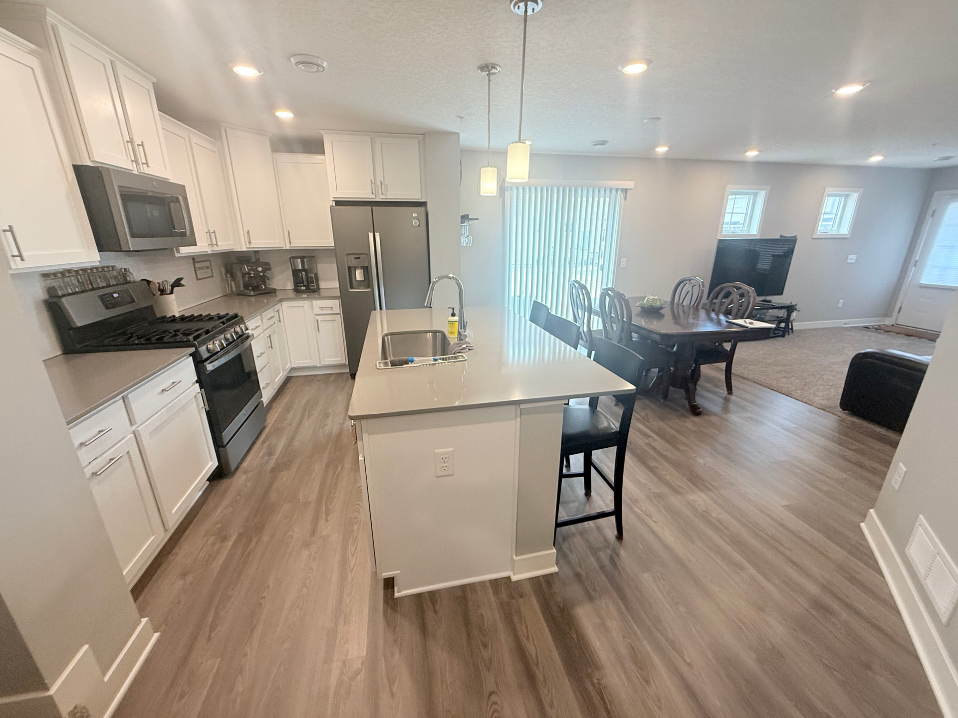 7238 Dora Drive, Hugo, MN 55038 The kitchen flows seamlessly into the dining and living areas, creating a space perfect for everyday living & entertaining.