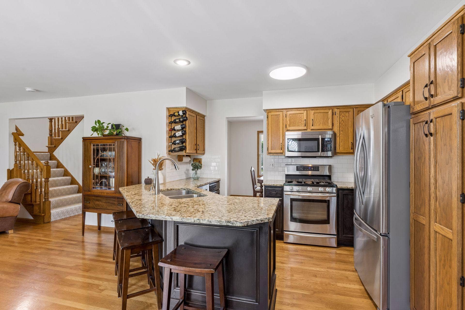 1008 Eagle Ridge Court, Stillwater, MN 55082 Another look at this beautiful kitchen, featuring stone countertops, generous cabinetry, and plenty of workspace.