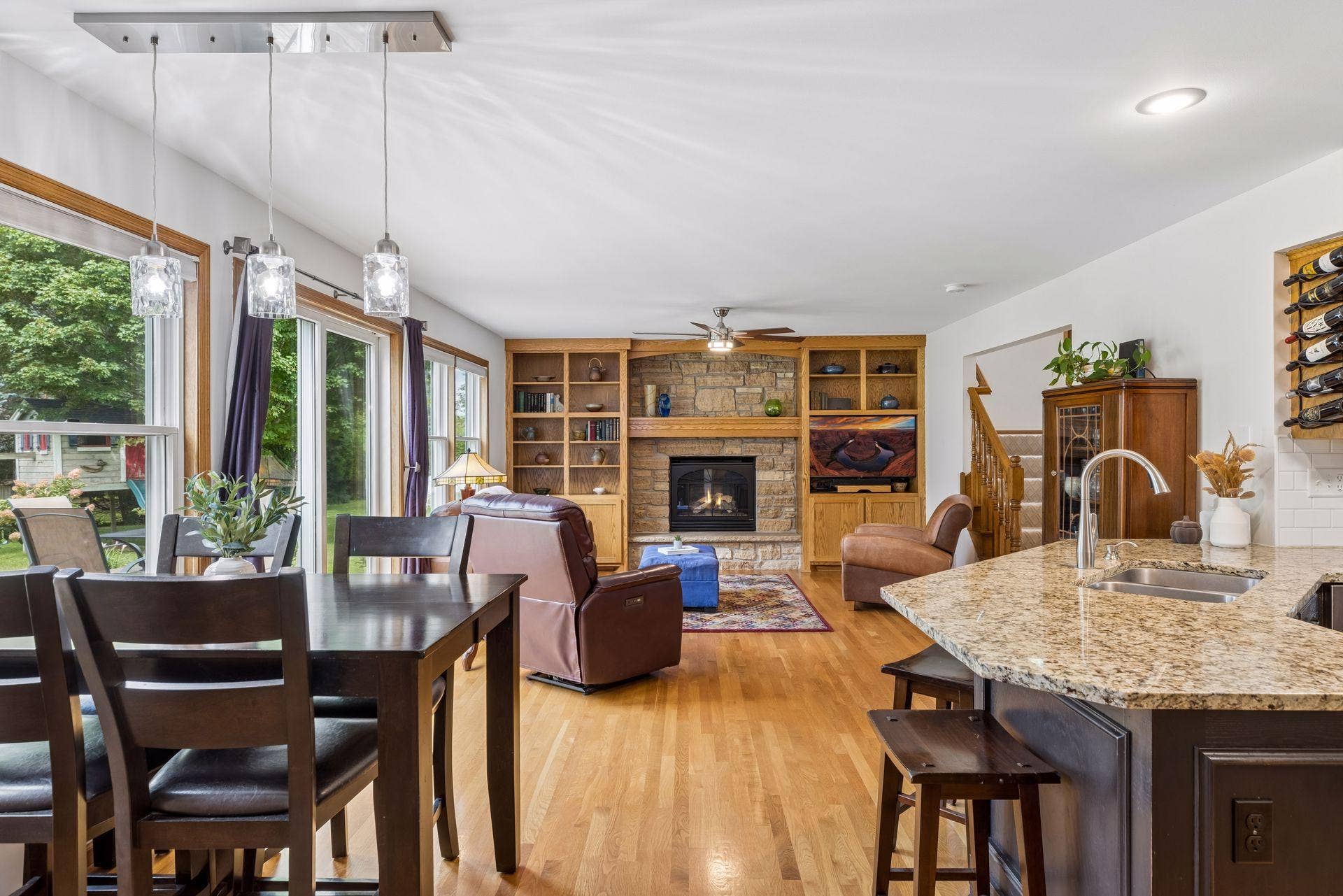 1008 Eagle Ridge Court, Stillwater, MN 55082 The living room is a true highlight, featuring beautiful custom cabinetry and a gas fireplace surrounded by locally sourced St. Croix stone.