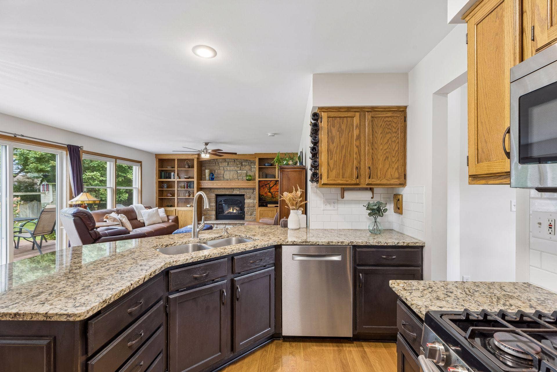 1008 Eagle Ridge Court, Stillwater, MN 55082 The kitchen flows seamlessly into the living room, where custom built-ins and a gas fireplace create a beautiful focal point.