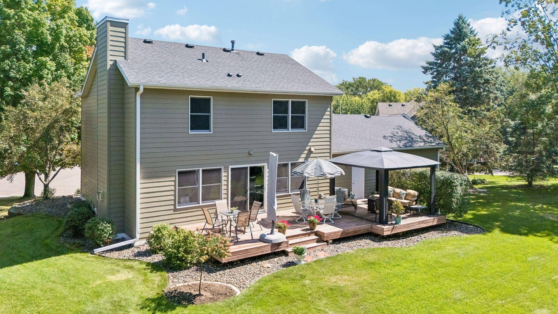 1008 Eagle Ridge Court, Stillwater, MN 55082 The expansive back deck offers multiple spaces to relax and entertain, complete with a pergola and screens for added comfort.