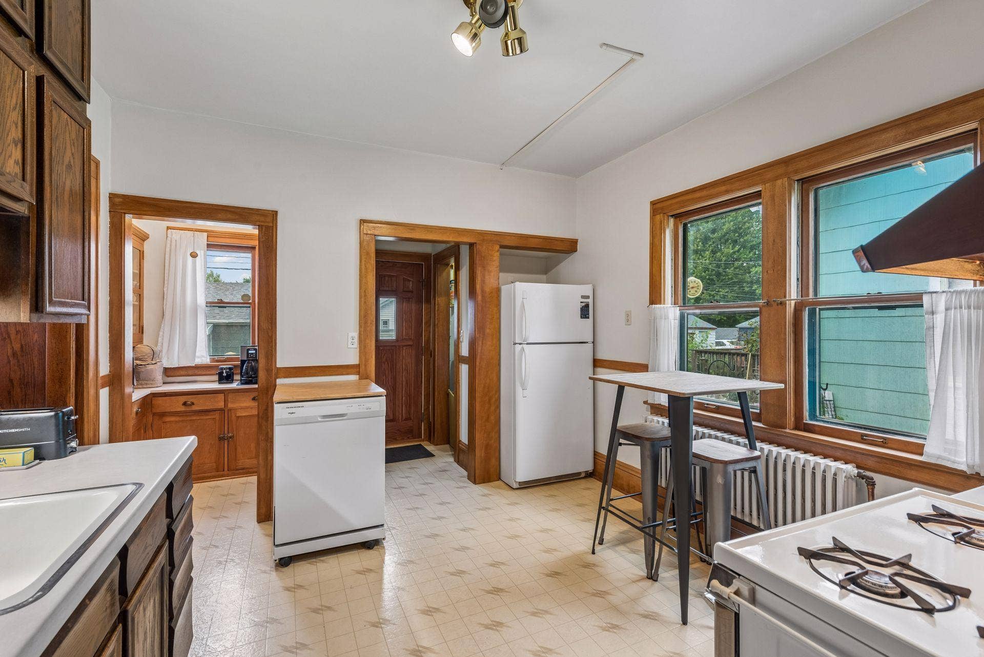 Kitchen includes large pantry and easy access to backyard