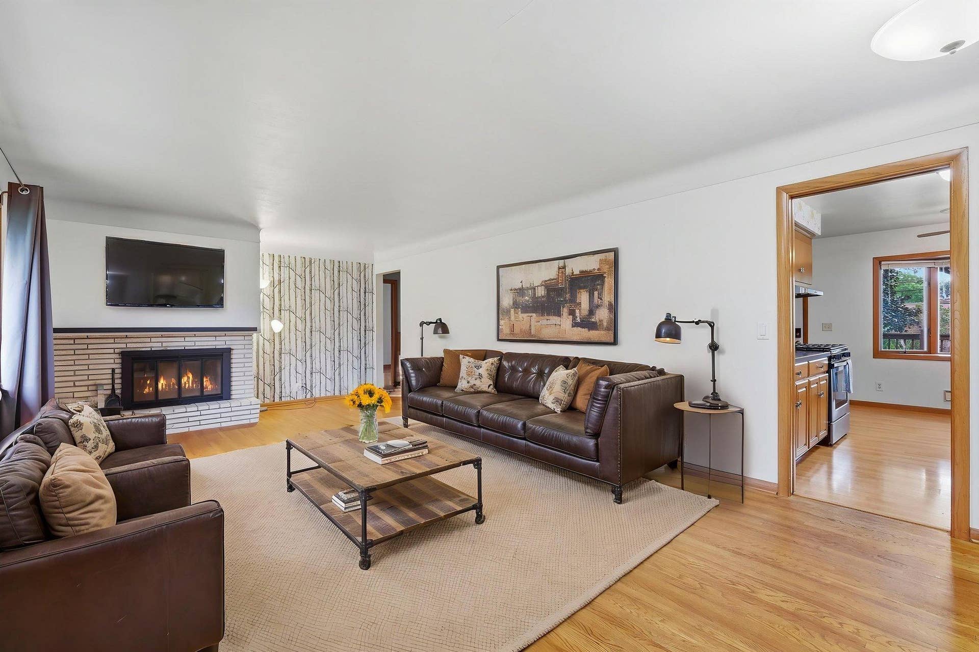 10019 Fremont Avenue S, Bloomington, MN 55431 Living room with fireplace. Virtually staged.