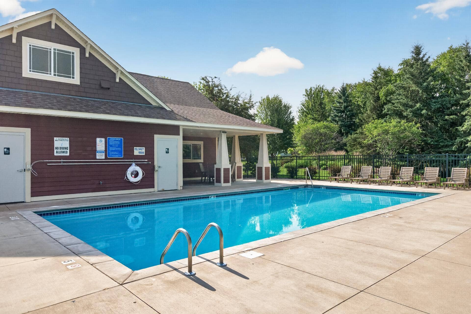 11631 Prospect Curve, Woodbury, MN 55129 When the summer heat hits, this refreshing heated in-ground pool and sun-soaked lounge chairs are waiting for you; just steps from your front door.