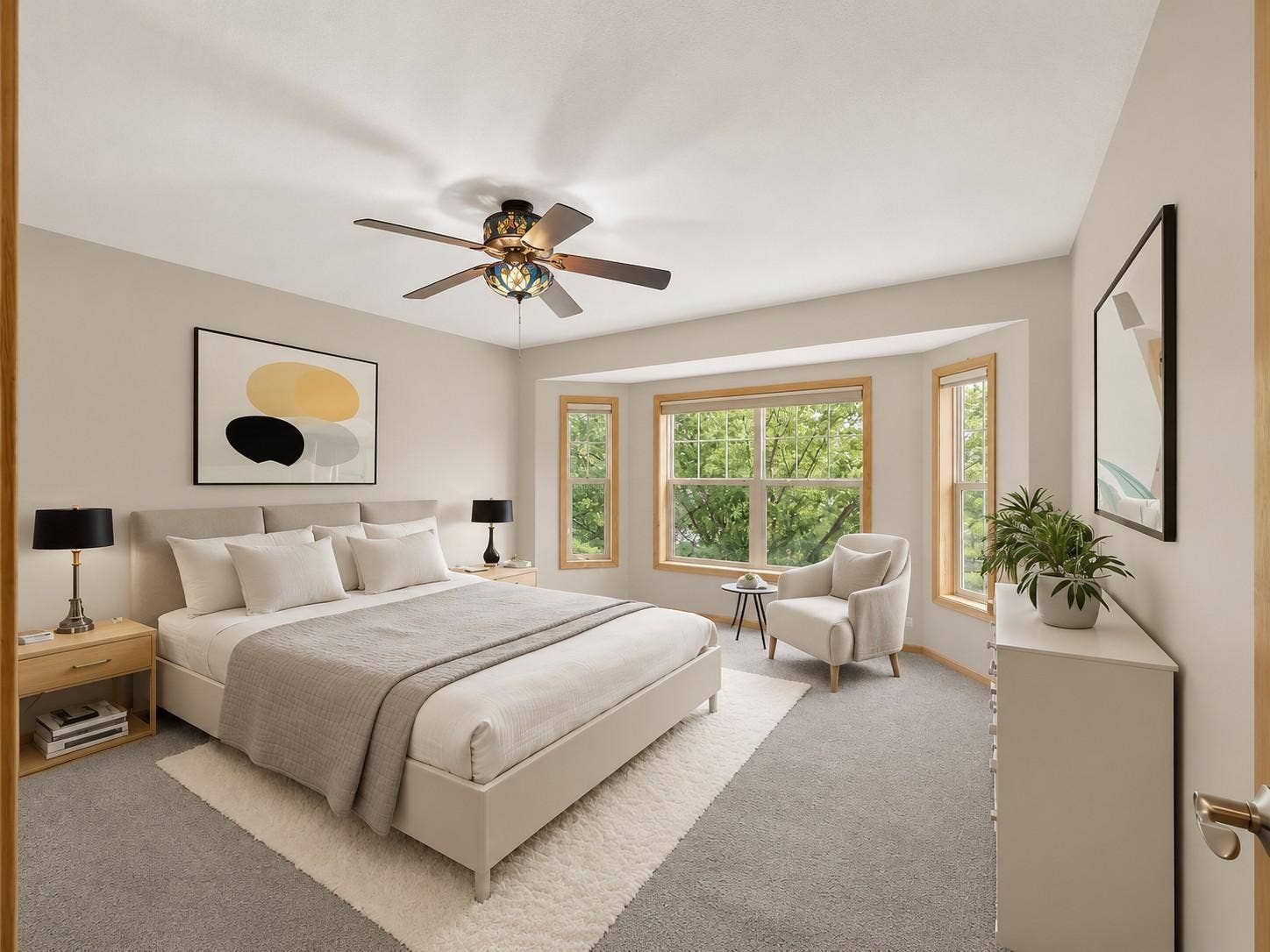 11631 Prospect Curve, Woodbury, MN 55129 Spacious primary suite featuring a charming bay window, large walk-in closet, and private ensuite bathroom.