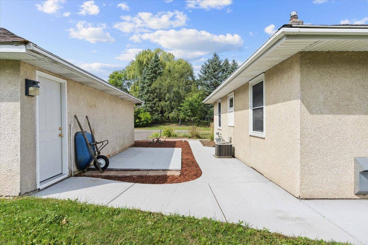 4090 Highland Avenue, White Bear Lake, MN 55110 Space between the garage and home with newer cement walkway