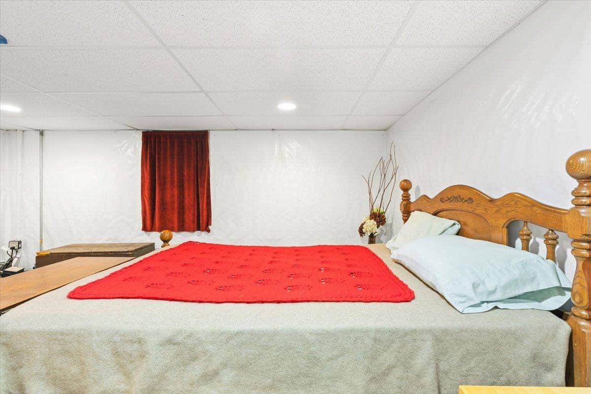 4090 Highland Avenue, White Bear Lake, MN 55110 4th bedroom. Was a storage area when owner bought the home. Added a legal size egress window and weather proofing to have a 4th bedroom! Great space in the lower level!