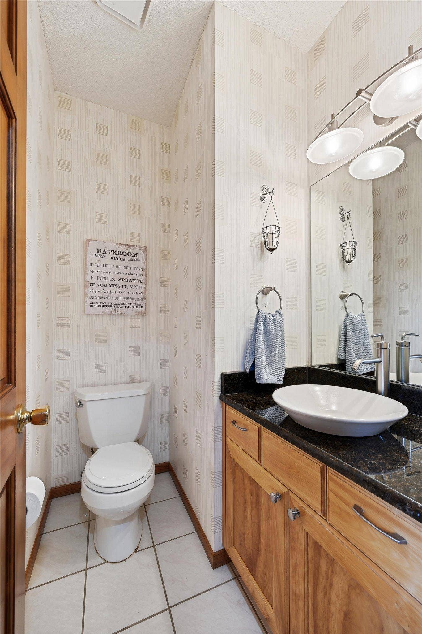 11412 Louisiana Avenue S, Bloomington, MN 55438 The main-level half bath adds convenience for everyday living and entertaining.